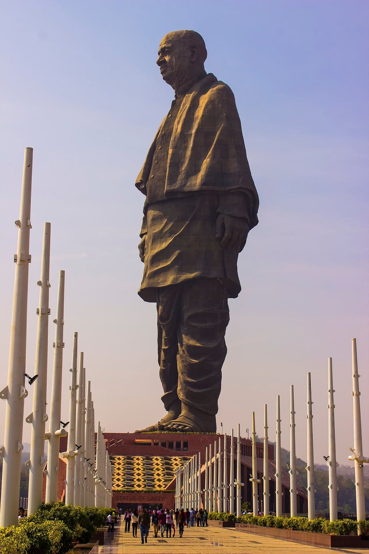 The Statue of Unity towering over the visitor walkway at Ekta Nagar
